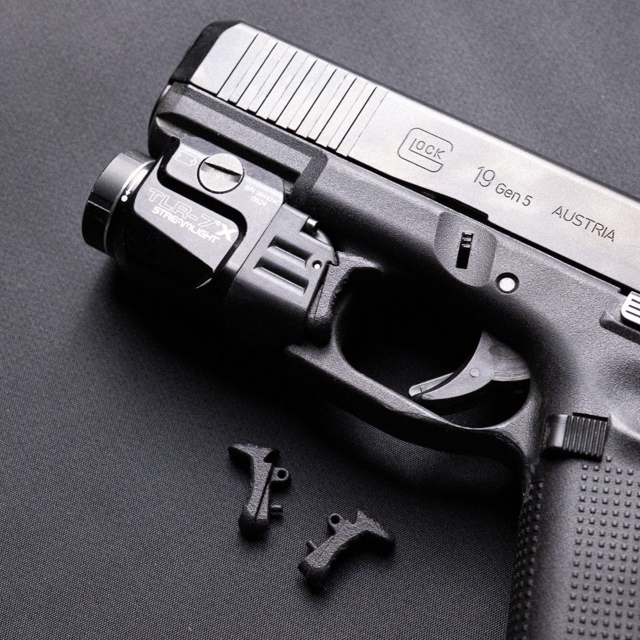 Glock 19 with Streamlight TLR‑7X and ČVIRIQ -Extended Streamlight TLR‑7X switches.