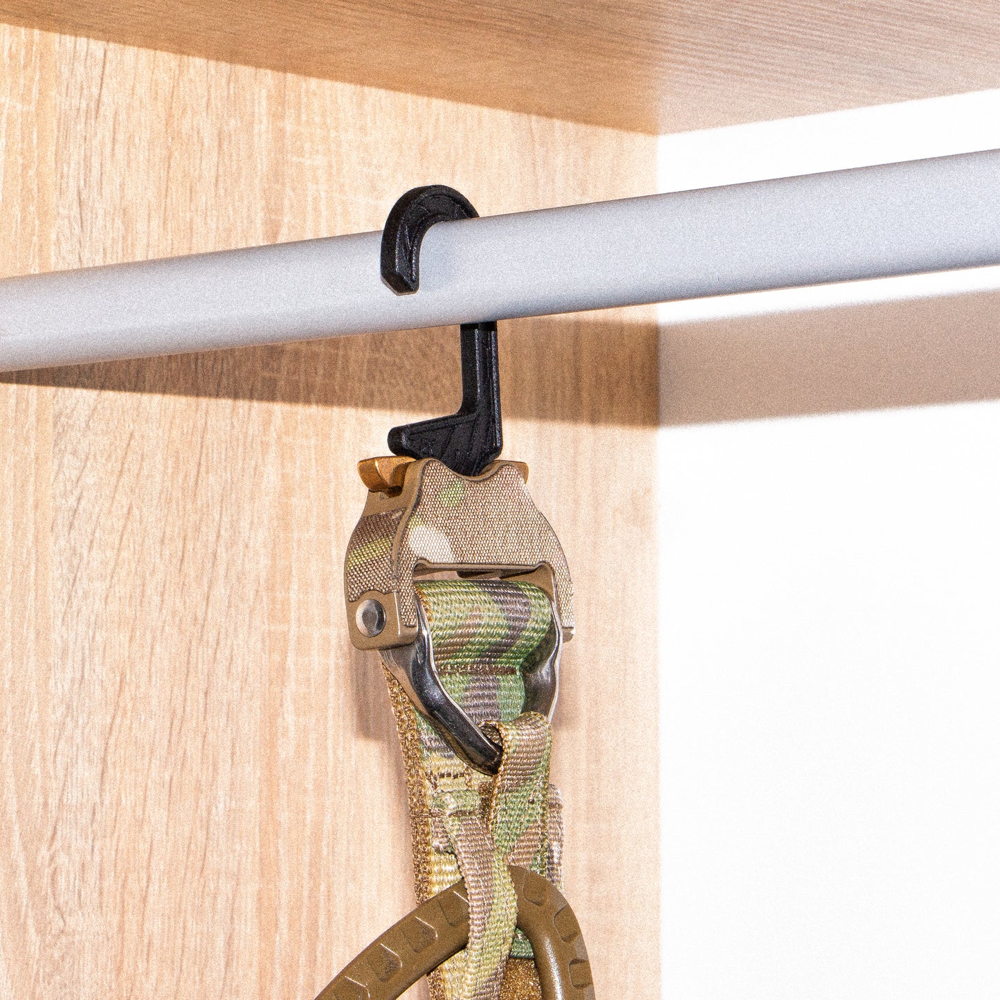 A black shooters belt hanger surface below.